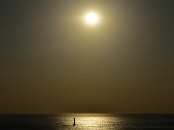 Wide shot at maximum eclipse
